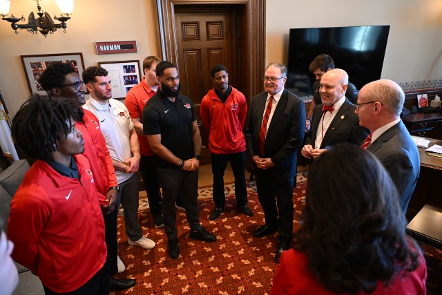Illinois Senate President talks with members of the Illinois State University football team during their recent visit to the Illinois State Capitol. The team went on an unprecedented run in the FCS playoffs to make it to the national championship game where they lost in overtime.